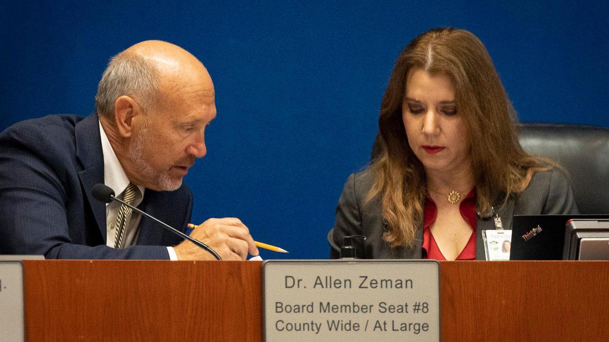 School Board member Allen Zeman talks to general council Marylin Batista during a Broward Country School Board meeting on new superintendent candidates on Monday, May 22, 2023, in Fort Lauderdale.