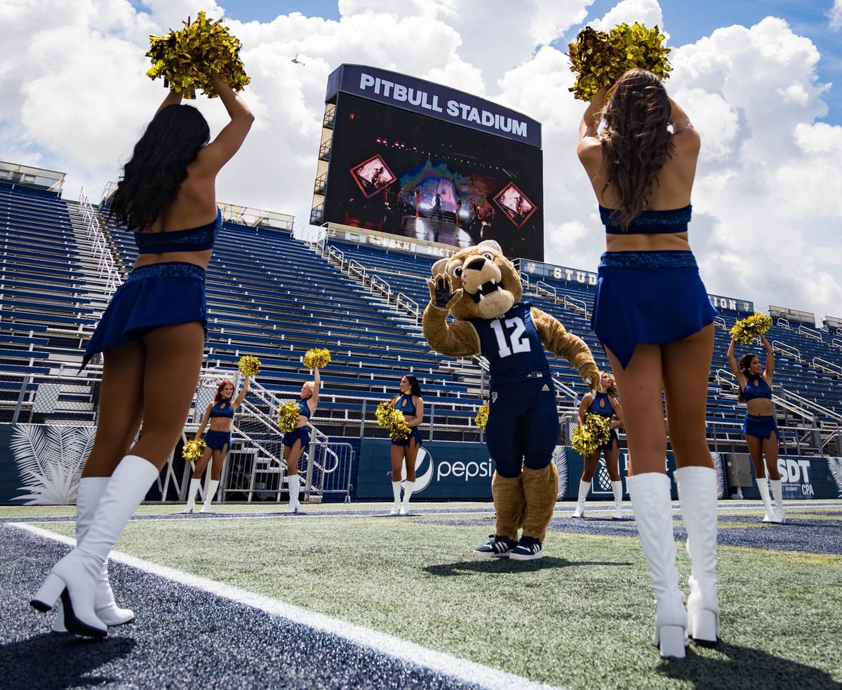 Florida International University mascot, Roary, and FIU Dazzlers celebrate the newly named Pitbull Stadium by dancing on the football field on Tuesday, August 6, 2024 in Miami, Fla.