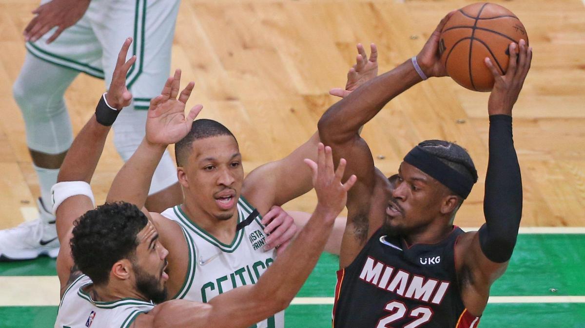 Miami Heat forward Jimmy Butler (22) looks to pass as Boston Celtics forward Jayson Tatum (0) and forward Grant Williams (12) defend in the first quarter in Game 4 of the Eastern Conference Finals at TD Garden in Boston on Monday, May 23, 2022.