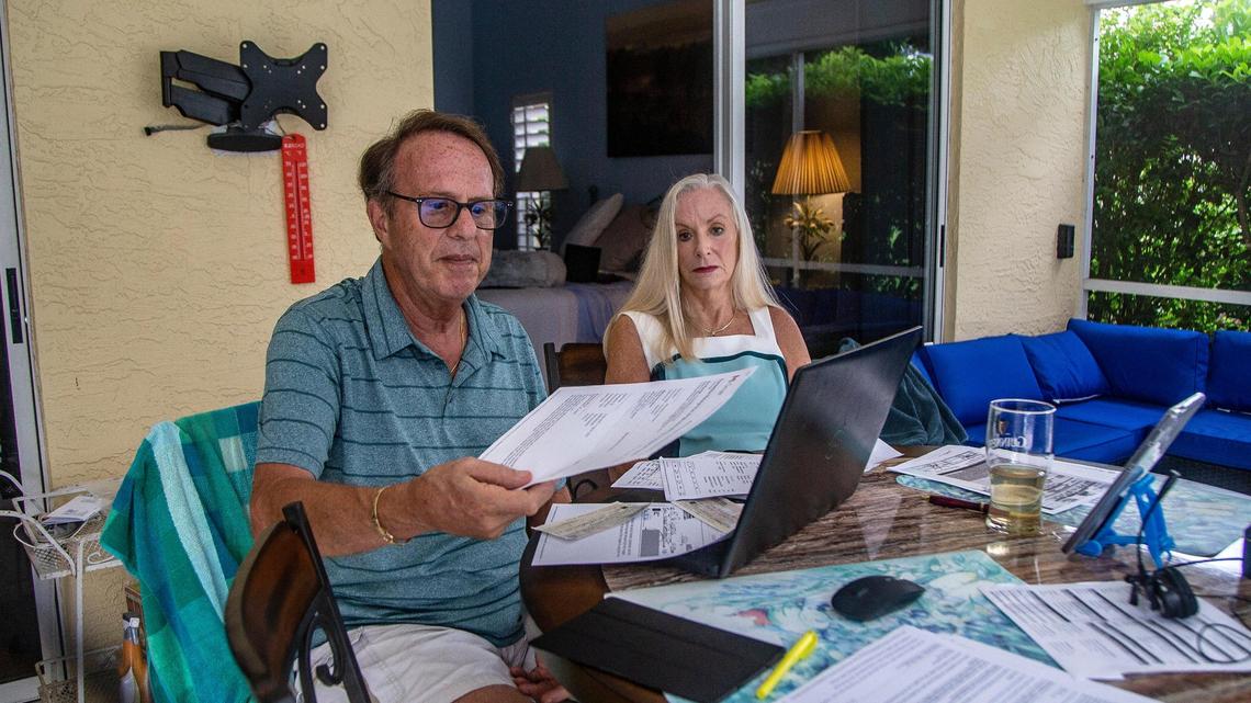 Richard and Dr. Christine Norman look over paperwork related to their cross-country move from Marina del Rey, California, to West Palm Beach.