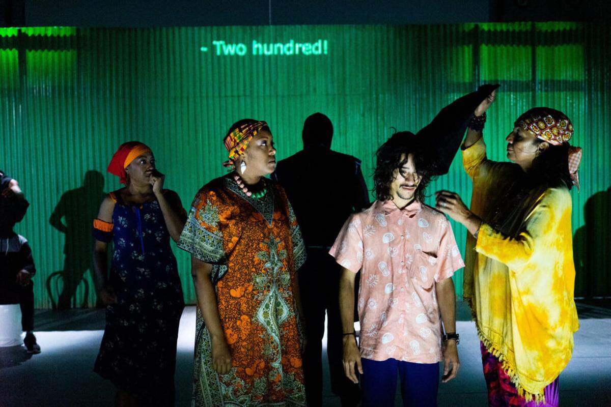 Nereida Machado, Betsayda Machado, Carlos Fabián Medina, and Blanca Castillo in “¡Viva La Parranda!” The presentation includes English supertitles on the back wall.