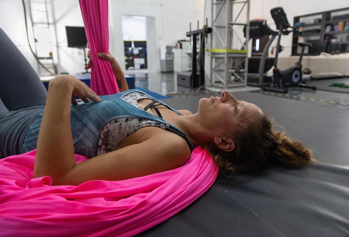 Mila Puletti rests while training silks at the Miami Circus Arts Center on Aug. 18, 2023, in Miami, Fla. “I love it so much that yes, it’s tiring, but even if it’s so tiring, I still love it.”