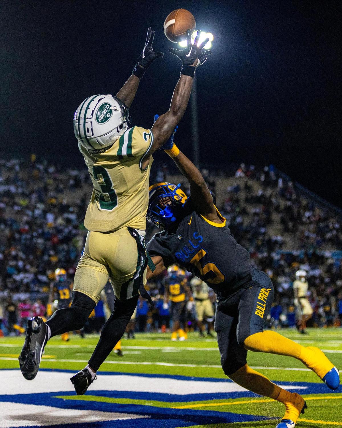 Miami Central wide receiver Khaleal Sterling 3X) makes a reception over Miami Northwestern defensive back Tywan Cox (5) during a high school football game at Traz Powell in Miami, Florida, on Friday, October 6, 2023.
