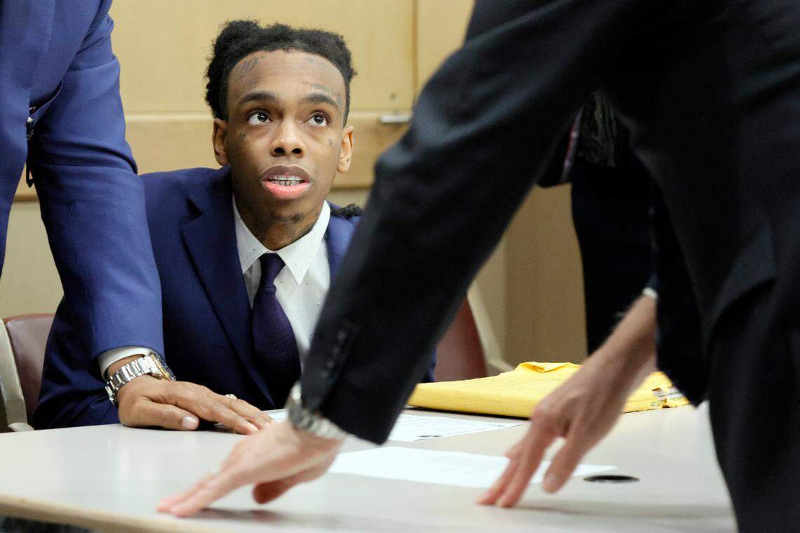 Jamell Demons, better known as rapper YNW Melly, looks up as members of his defense team confer while the jury deliberates at the Broward County Courthouse in Fort Lauderdale on Friday, July 21, 2023. Demons, 22, is accused of killing two fellow rappers and conspiring to make it look like a drive-by shooting in October 2018. (Amy Beth Bennett / South Florida Sun Sentinel)