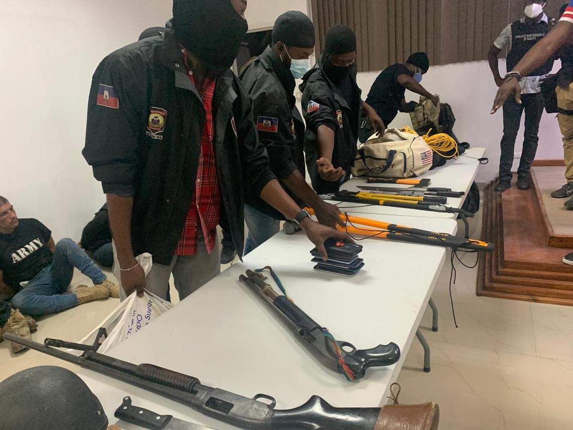 Haiti police display some of the weapons they say they took from men who were involved in the assassination of President Jovenel Moïse.