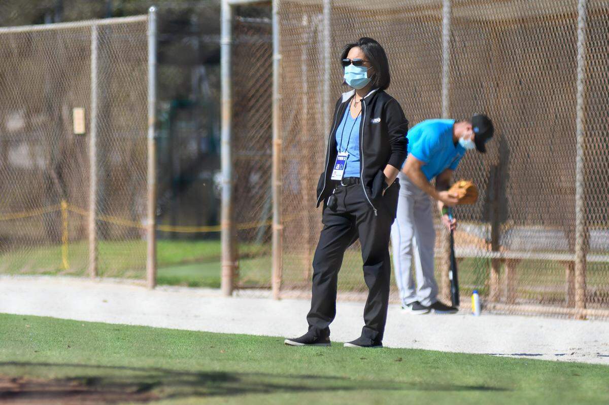 Miami Marlins general manager Kim Ng watching batting practice during a spring training workout on Thursday, Feb. 25, 2021, at the Roger Dean Chevrolet Stadium Complex in Jupiter, Florida.