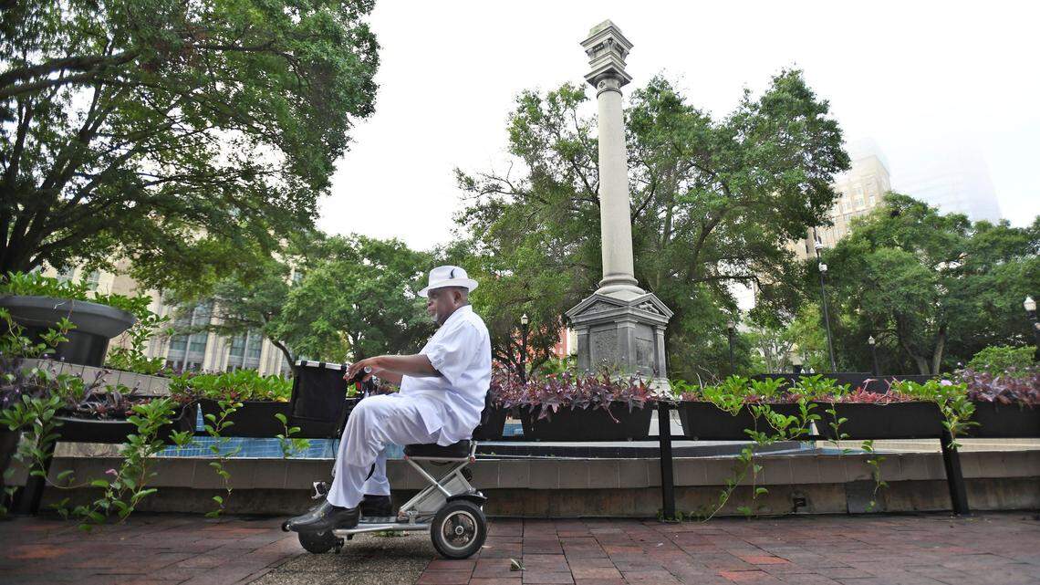 Ben Frazier, founder and president of the Northside Coalition of Jacksonville, who organized much of the movement to take down Confederate monuments in Jacksonville, passes the column of the partially dismantled Confederate Monument in Hemming Park on June 9, 2020. The monument erected in 1898 had been partially dismantled, with the Confederate soldier statue that topped it off and the bronze plaques around the base removed that morning.