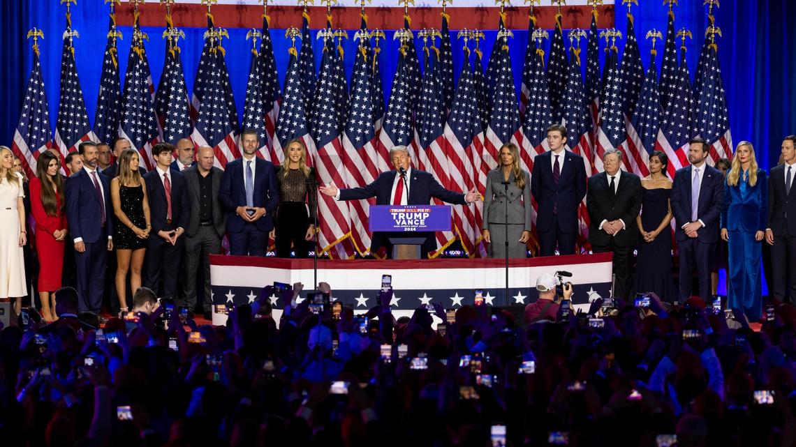 Republican presidential nominee former President Donald Trump speaks during his election night party flanked by family and friends at the Palm Beach County Convention Center on Tuesday, Nov. 5, 2024, in West Palm Beach, Fla.