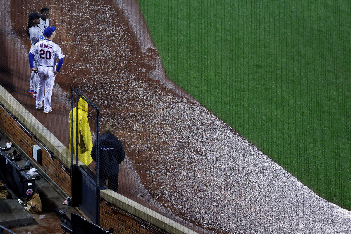 Sep 28, 2023; New York City, New York, USA; New York Mets first baseman Pete Alonso (20) talks to Miami Marlins first baseman Josh Bell (9) and center fielder Jazz Chisholm Jr. (2) during a rain delay during the ninth inning at Citi Field. Mandatory Credit: Brad Penner-USA TODAY Sports