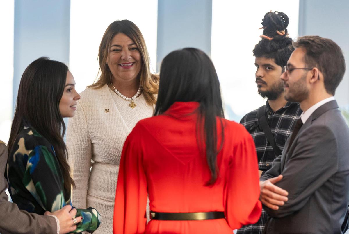 Miami Dade College President Madeline Pumariega, in white suit, talks with guests before U.S. Supreme Court Justice Sonia Sotomayor has a conversation with Knight Foundation President and CEO Maribel Pérez Wadsworth at the Miami Dade College Padron Campus on Tuesday, Feb. 11, 2025, in Miami, Fla.