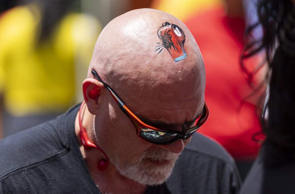 David Schaeffer, from North Carolina, gets a whistle airbrushed on his head during the FIFA Fan Festival Miami at Bayfront Park on Saturday, June 13, 2026, in downtown Miami, Fla.