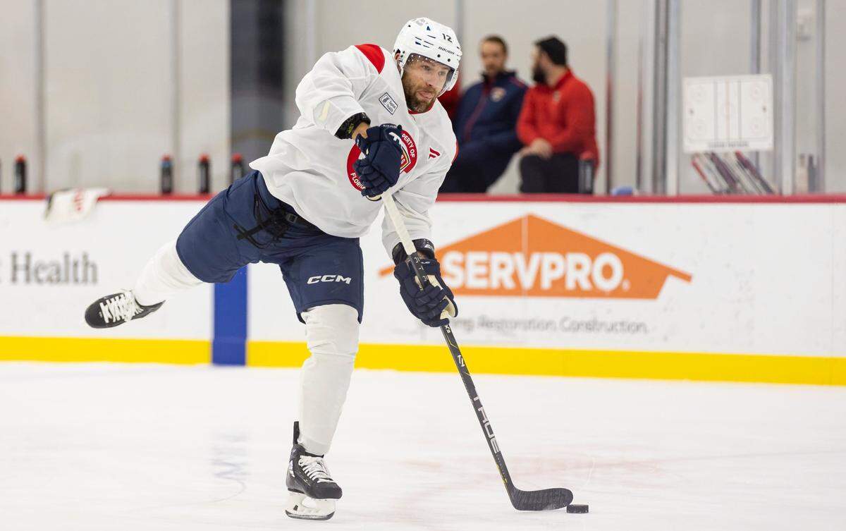 Florida Panthers forward Jonah Gadjovich (12) shoots the puck during training camp at the Baptist Health IcePlex on Thursday, Sept. 19, 2024, in Fort Lauderdale, Fla.