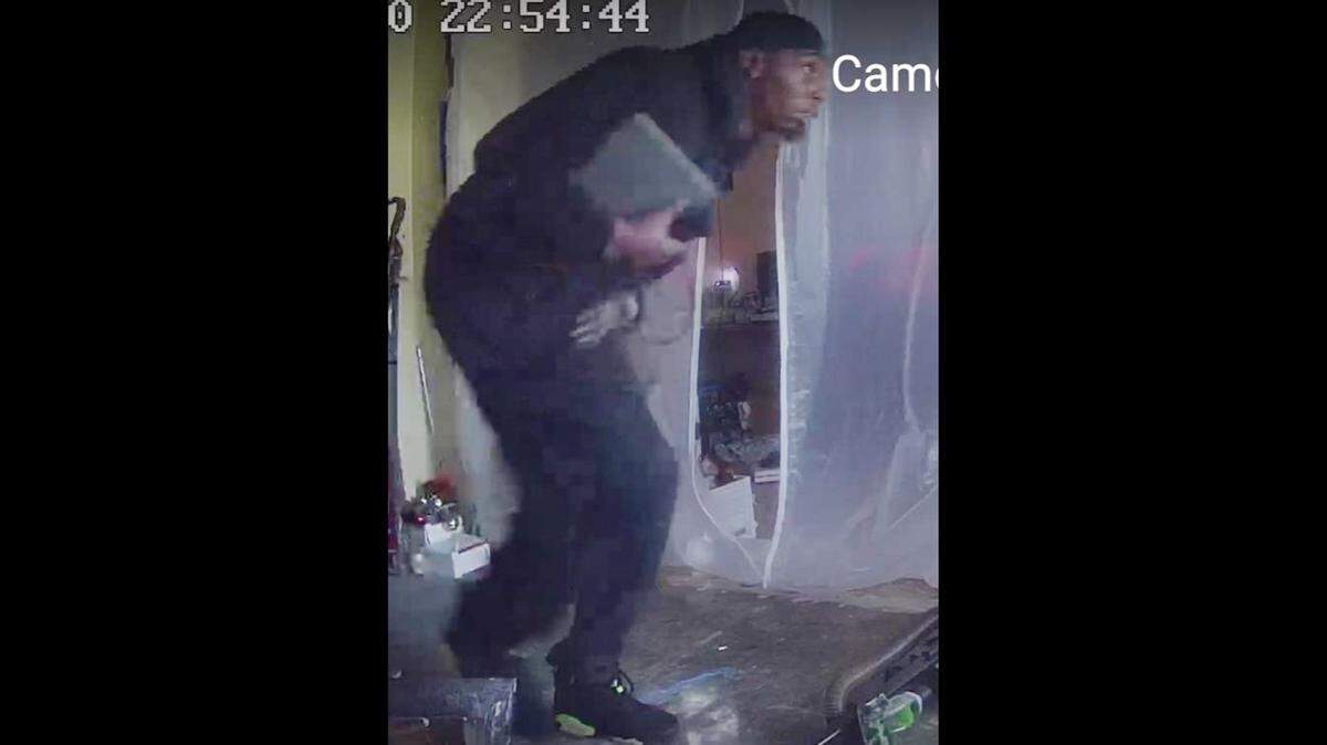 Screengrab image provided by Polk County Sheriff’s Office of a suspect stealing Christmas presents and other items from a Lakeland home on Dec. 20, 2021.