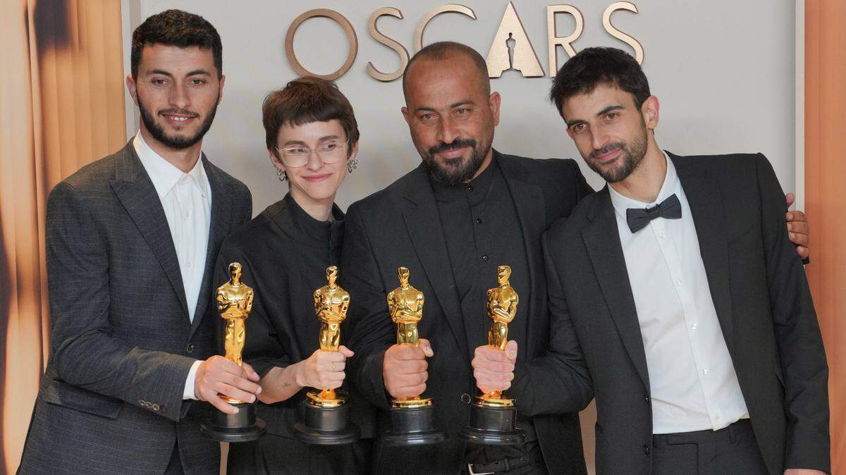 After Sunday’s Oscar win, (L-R) Basel Adra, Rachel Szor, Hamdan Ballal, Yuval Abraham, winners of the Best Documentary Feature Film for “No Other Land”, pose in the press room at the Academy Awards.
