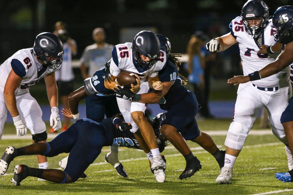Columbus Explorers quarterback Alberto Mendoza (15) runs with the football during the first half of a high school football game against the Palmetto Panthers at Tropical Park in Miami, Florida, Friday, September 16, 2022.