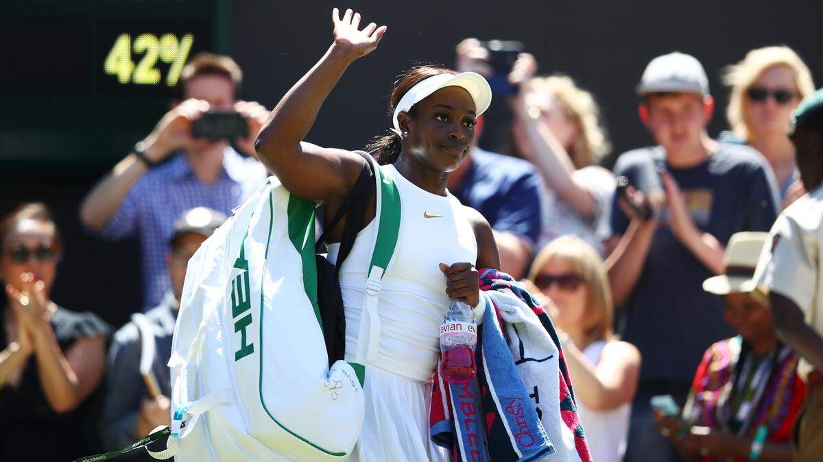 Sloane Stephens of the United States leaves the court after being defeated by Donna Vekic of Croatia during their Ladies' Singles first round match against on day one of the Wimbledon Lawn Tennis Championships at All England Lawn Tennis and Croquet Club on July 2, 2018 in London, England.