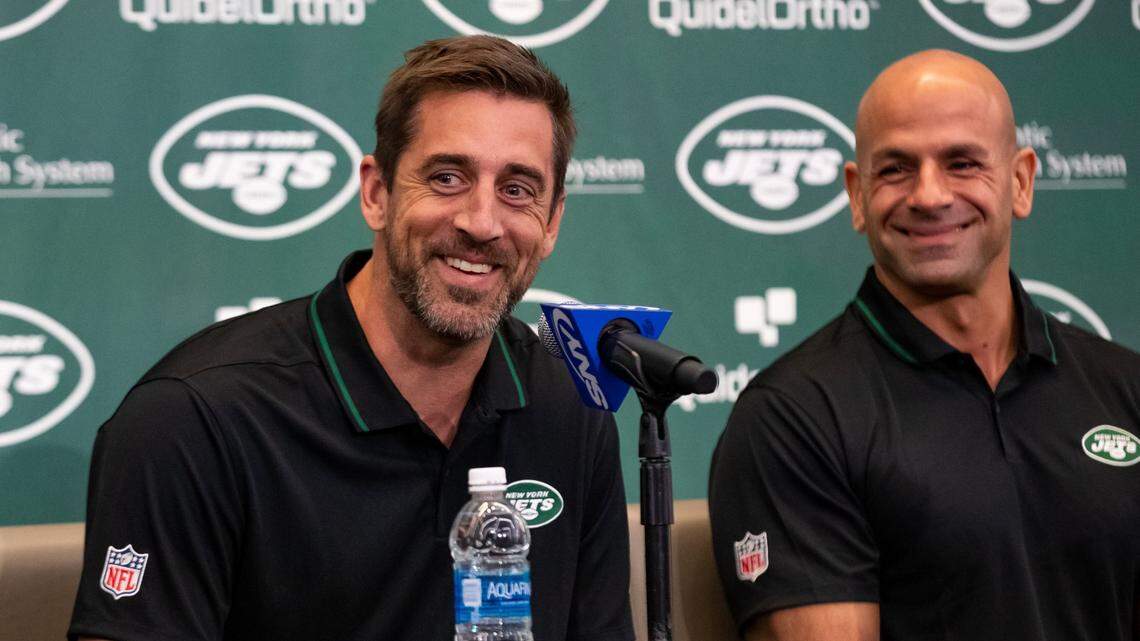 Apr 26, 2023; Florham Park, NJ, USA; New York Jets quarterback Aaron Rodgers (8) (right) and New York Jets head coach Robert Saleh (left) address the media during the introductory press conference at Atlantic Health Jets Training Center. Mandatory Credit: Tom Horak-USA TODAY Sports