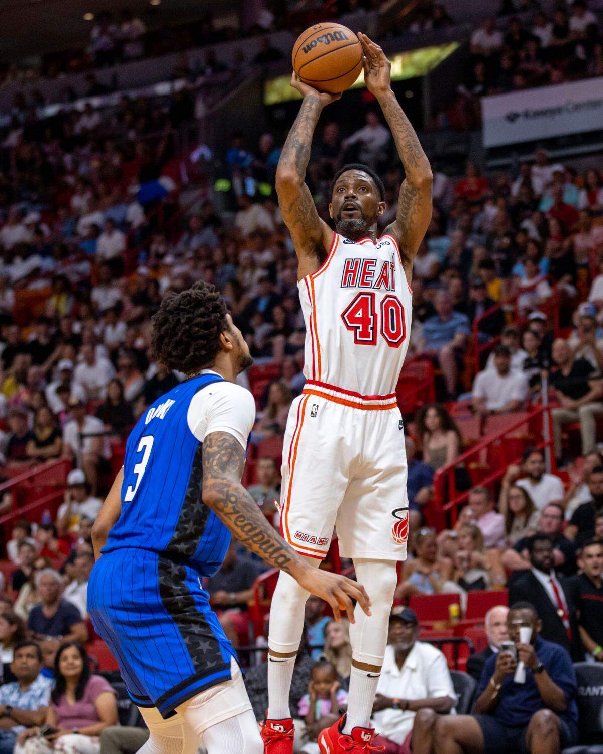 Miami Heat forward Udonis Haslem (40) shoots a jumper over Orlando Magic forward Chuma Okeke (3) during the first quarter of an NBA game at Kaseya Center in Downtown Miami, Florida, on Sunday, April 9, 2023.