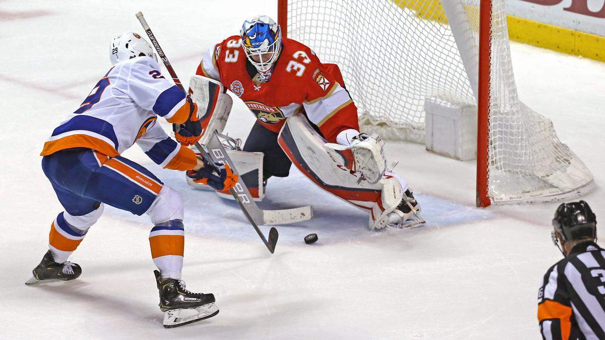 New York Islanders center Brock Nelson (29) scores the winning goal against Florida Panthers goalie Sam Montembeault (33) during the shootout of an NHL regular season hockey game at the BB&T Center on Thursday, April 4, 2019 in Sunrise.