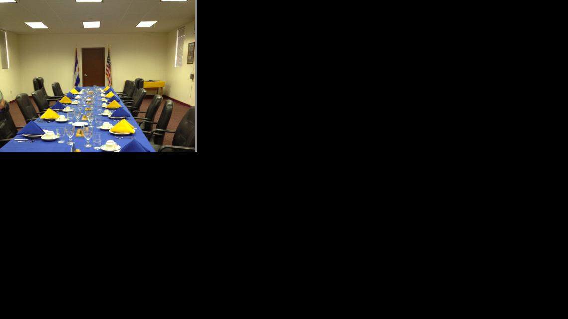 The flags of Cuba and the United States flank the door inside a meeting room for U.S. and Cuban military officials at the Northeast Gate at the U.S. Navy base at Guantanamo Bay, Cuba.