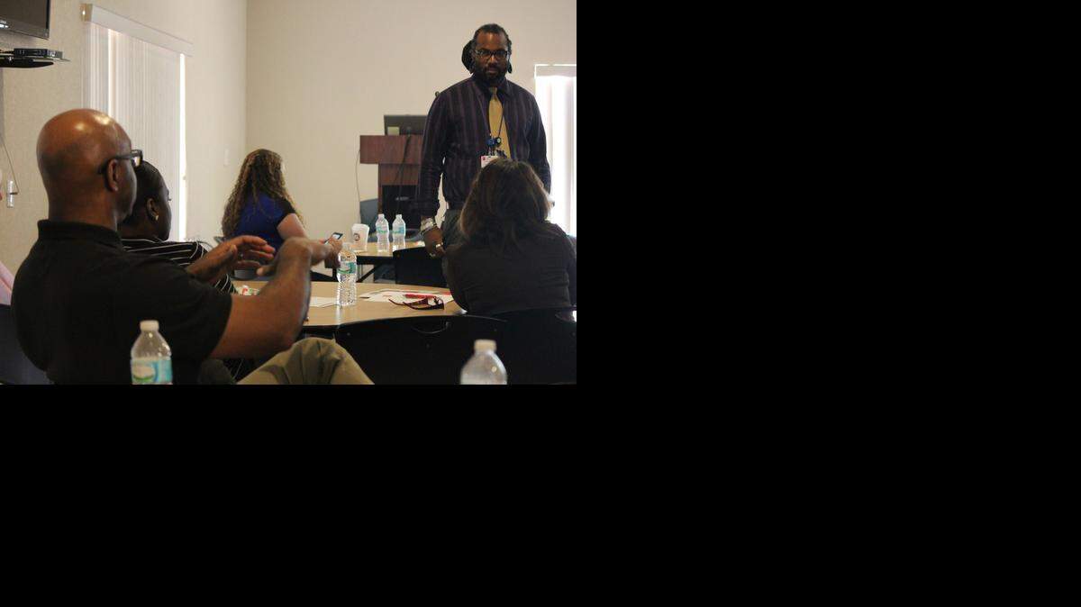 <cutline_leadin>TELL-TALE SIGNS: </cutline_leadin>Ron C. Osborne-Williams of Women in Distress in Broward presents a class for police officers on identifying victims of domestic violence earlier this month. Below, BSO Sgt. Charlie Carrillo pays close attention<137> during a countywide law enforcement training class on domestic to a group of victim advocates and police officers at the Jim and Jan Moran Family Center located in Deerfield Beach on Oct. 17<137>.