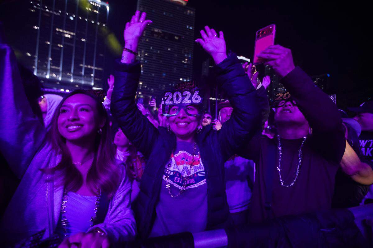 A person celebrates the new year listening to music during New Year’s Eve celebrations at Bayfront Park.