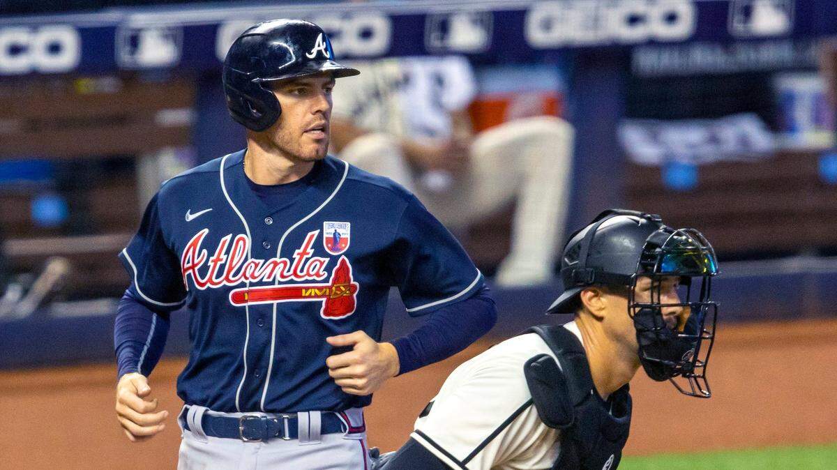 Atlanta Braves first baseman Freddie Freeman (5) scores a run during the seventh inning off a Nick Markakis (22) line drive double during a Major League Baseball game against the Miami Marlins at Marlins Park in Miami, Florida on Sunday, August 16, 2020.