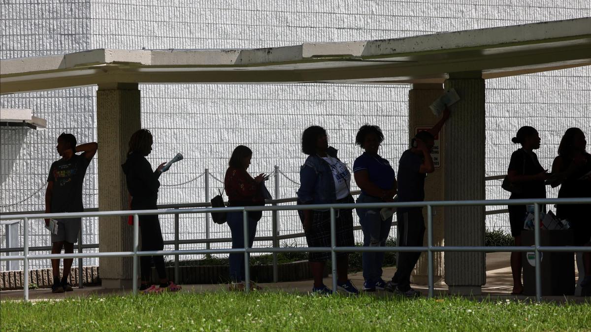 Miami-Dade residents wait up to 50 minutes in line to vote at the Joseph Caleb Center during the ‘Souls to the Polls’ event on the last day of early voting on Sunday, Nov. 3, 2024, in Miami, Florida.