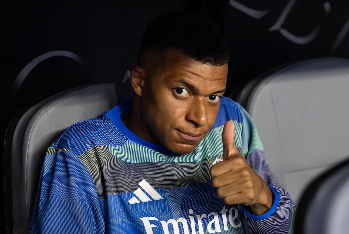 Real Madrid CF forward Kylian Mbappe (9) reacts while sitting on the bench before his team plays against Juventus in their round of 16 FIFA Club World Cup soccer match at Hard Rock Stadium on Tuesday, July 1, 2025, in Miami Gardens, Fla.