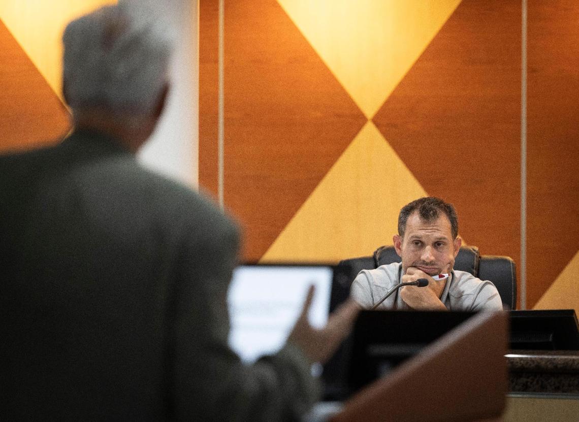 Vice Mayor Jeff Rose watches former Surfside Mayor Charles Burkett speak during a commission meeting on Tuesday, March 12, 2024, at Surfside Town Hall.