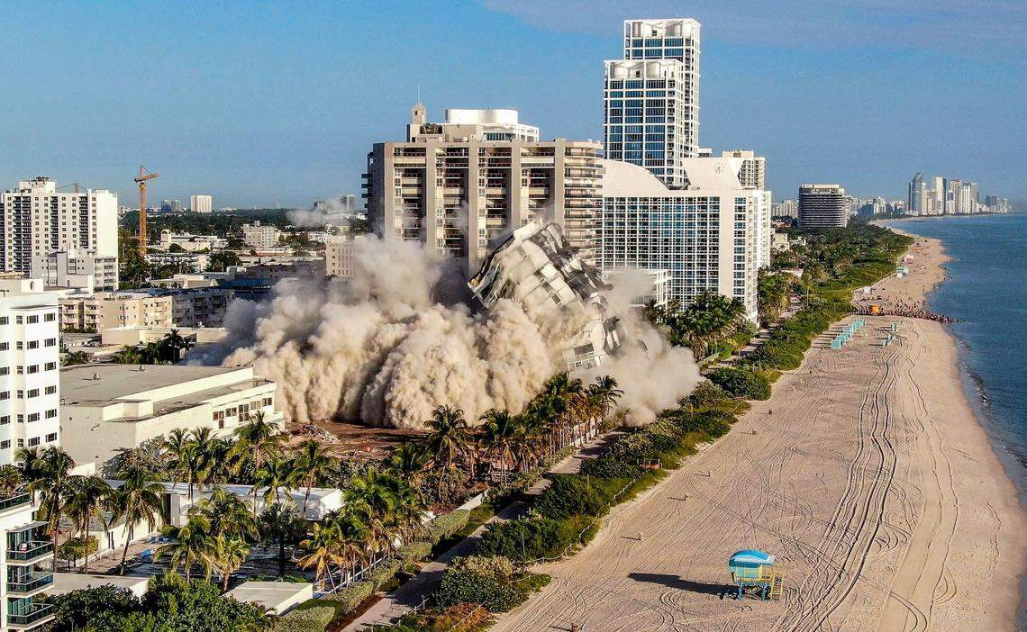 Miami Beach’s 17-story hotel tower of the historic Deauville Beach Resort implodes approximately at 8:00 am sending dust full of debris into the oceanside luxury buildings. Sunday November 13, 2022.