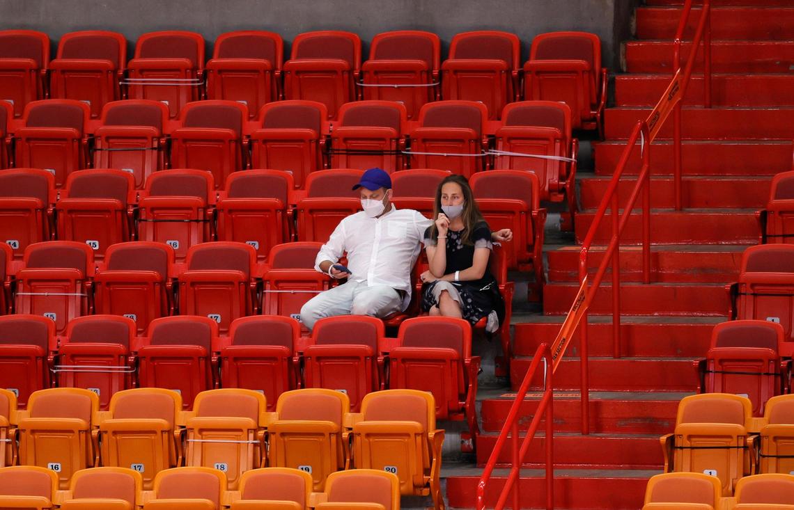Fans looks from their seats at sections 117 and 118 in the lower bowl designated for fully vaccinated fans in the first quarter of their NBA basketball game between the Miami Heat against the Golden State Warriors at the AmericanAirlines Arena on Thursday, April 1, 2021 in Miami, Fl. The Heat increase the number of fans allowed to attend games at AmericanAirlines Arena to about 4,000 just about 20 percent of the building’s usual capacity of 19,600.