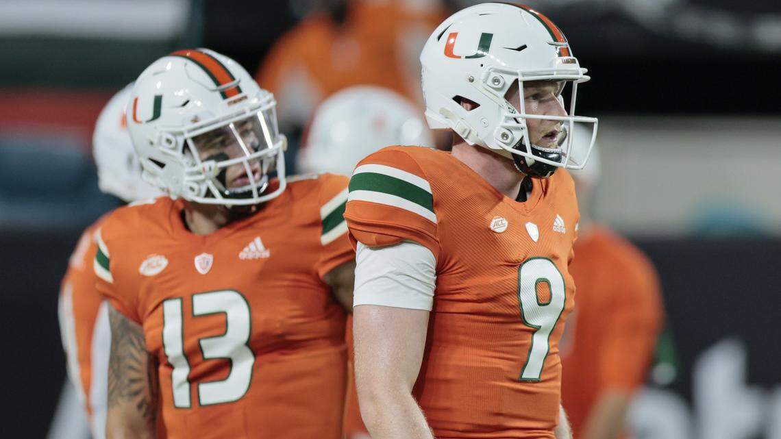 Miami Hurricanes quarterback Tyler Van Dyke (9)*and quarterback Jake Garcia (13) warmup before the start of game against Florida State Seminoles at Hard Rock Stadium in Miami Gardens on Saturday, November 5, 2022.
