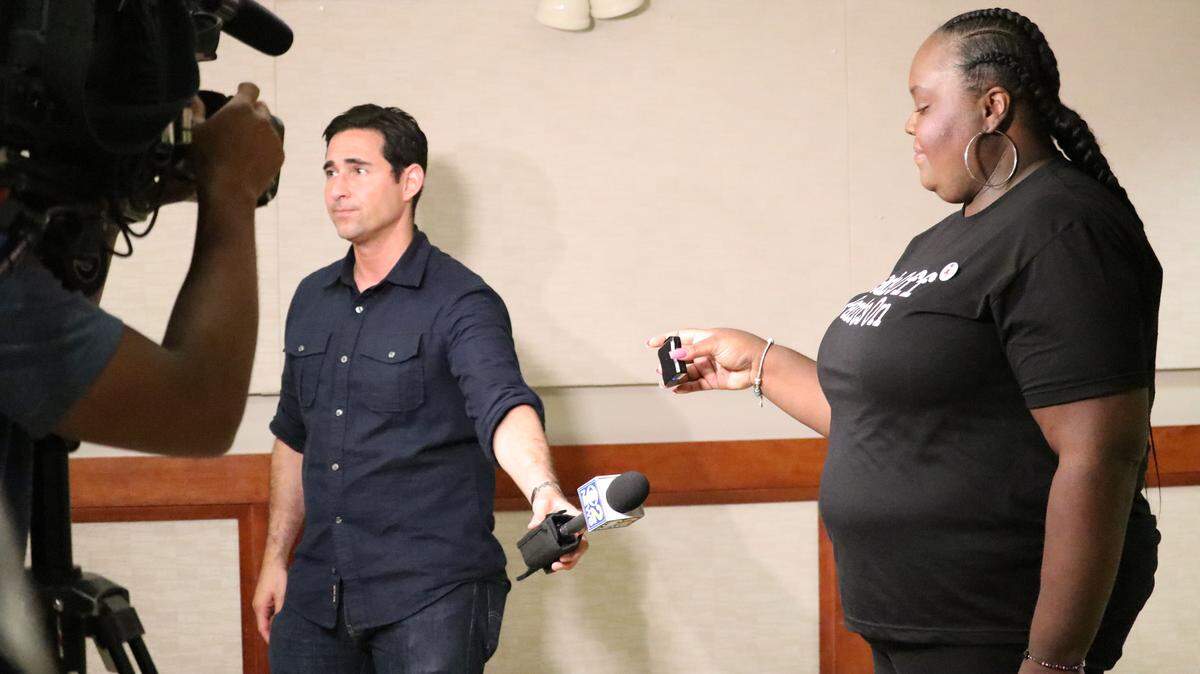 Unite Here Local 1 housekeeper, Latonia, who works in a Chicago hotel and asked to be called by her first name only, holds a panic button after the city of Chicago mandated that all hotels provide their housekeepers with the devices. The ordinance helped pave the way for Miami Beach’s panic button regulations.