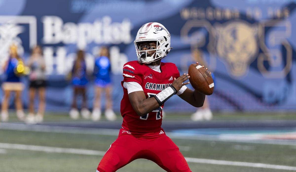 Chaminade-Madonna Lions quarterback Malik Leonard (14) looks to throw the ball in the first half of his Class 1A state championship football game against the Cardinal Newman Crusaders at Pitbull Stadium on Thursday, Dec. 11, 2025, in Miami, Fla.