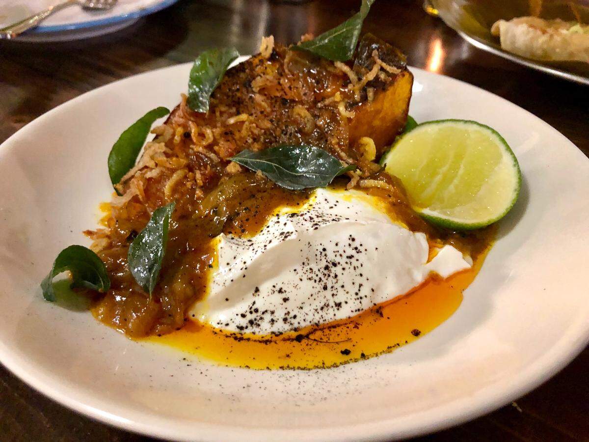 Roasted curry calabaza with tart labneh yogurt, black lime and fried curry leaves at the new Balloo