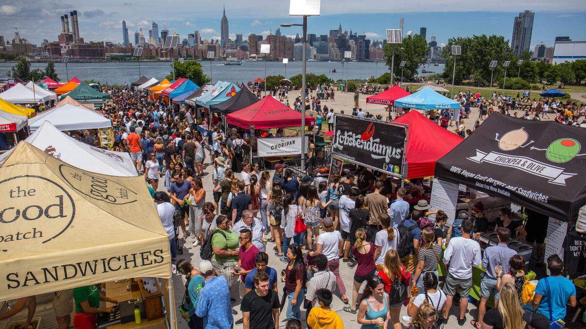 Visitors pack the original Smorgasburg in Williamsburg, New York, which regularly draws 10,000 on the weekends. Now the outdoor food market is coming to Miami.
