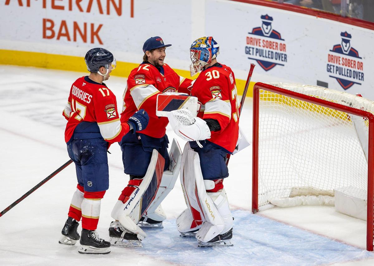 Florida Panthers goaltender Spencer Knight (30) celebrates with teammates Sergei Bobrovsky (72) and Evan Rodrigues (17) after shutting out the Anaheim Ducks 3-0 at Amerant Bank Arena on Saturday, Jan. 18, 2025, in Sunrise, Fla.