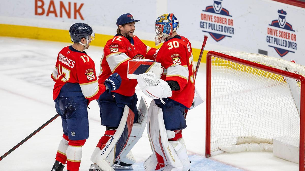Florida Panthers goaltender Spencer Knight (30) celebrates with teammates Sergei Bobrovsky (72) and Evan Rodrigues (17) after shutting out the Anaheim Ducks 3-0 at Amerant Bank Arena on Saturday, Jan. 18, 2025, in Sunrise, Fla.