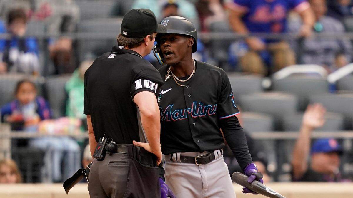 Umpire Phil Cuzzi (10) throws Miami Marlins’ Jazz Chisholm Jr., right, out of the game after arguing balls and strikes in the ninth inning of a baseball game against the New York Mets, Saturday, June 18, 2022, in New York. (AP Photo/John Minchillo)