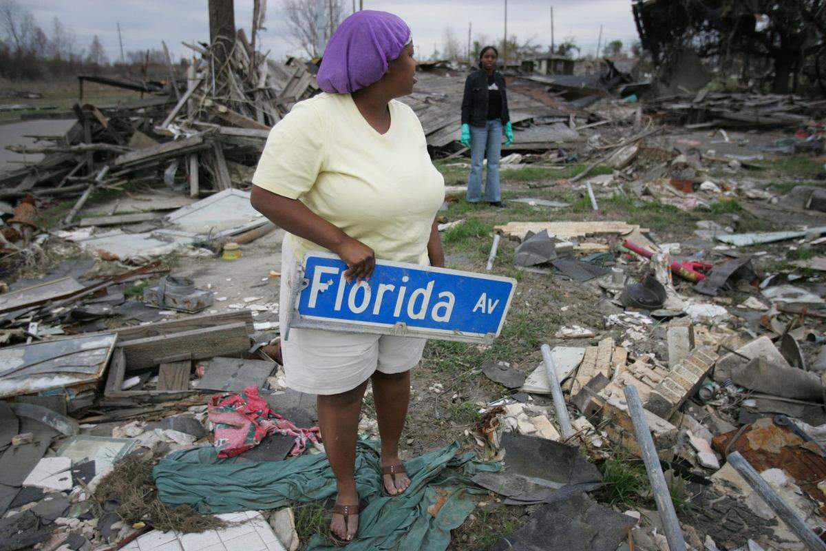 Trace Brown, 27, (left) and her sister Valire Bentley, 23, stand among the rubble after the breached levees from Hurricane Katrina destroyed her home on what used to be Florida Street in the Lower Ninth Ward in New Orleans Friday December 2, 2005.