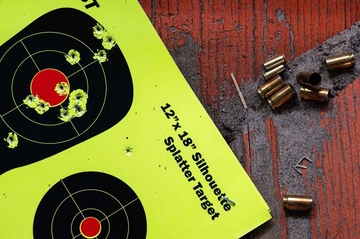 Spent rounds of ammunition and a used target are seen on a table at Shoot GTR, located at 1610 NW 65th Pl., in Gainesville, Fla., on Sept. 20, 2023.