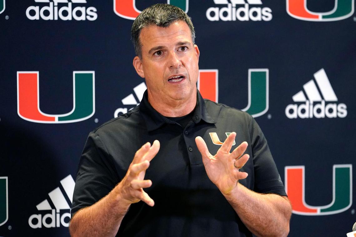 Miami head coach Mario Cristobal talks with the media at the team’s NCAA college football media day, Tuesday, Aug. 2, 2022, in Coral Gables, Fla. (AP Photo/Lynne Sladky)