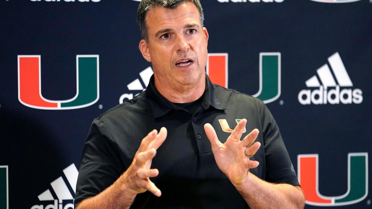 Miami head coach Mario Cristobal talks with the media at the team’s NCAA college football media day, Tuesday, Aug. 2, 2022, in Coral Gables, Fla. (AP Photo/Lynne Sladky)