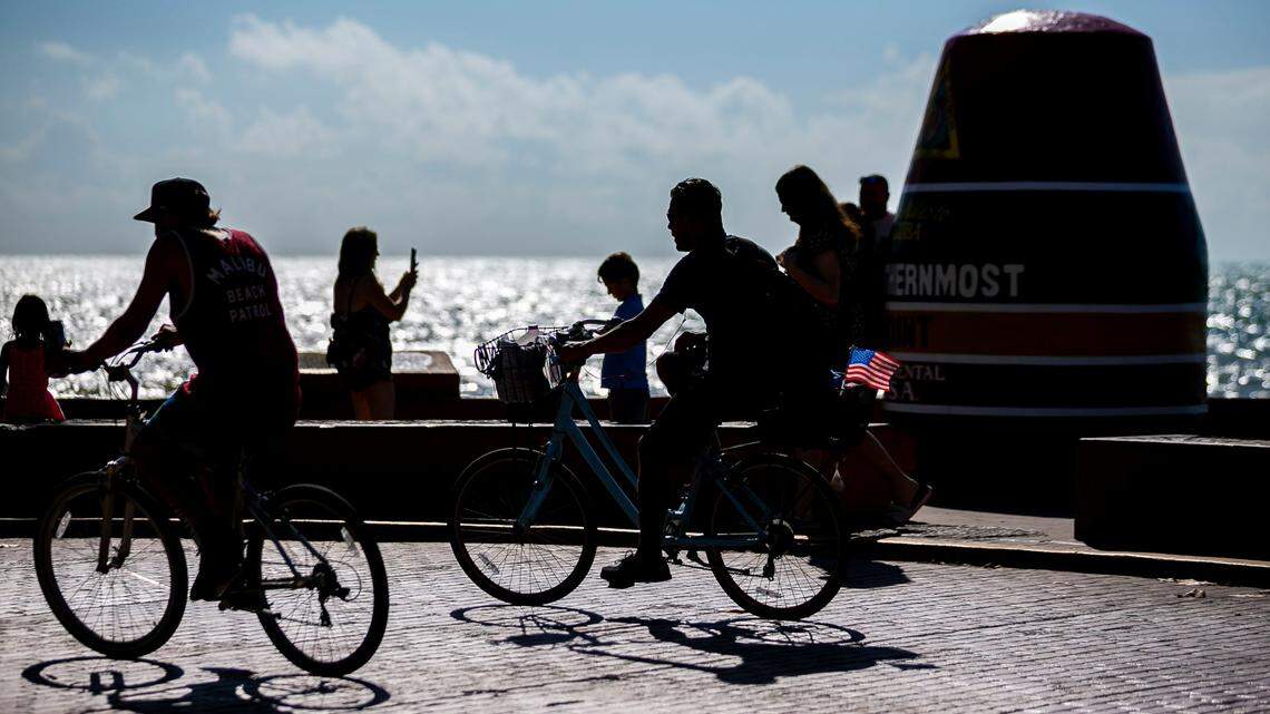 Tourists visit the Southernmost Point of the Continental U.S. in Key West on Saturday, Dec. 11, 2021.
