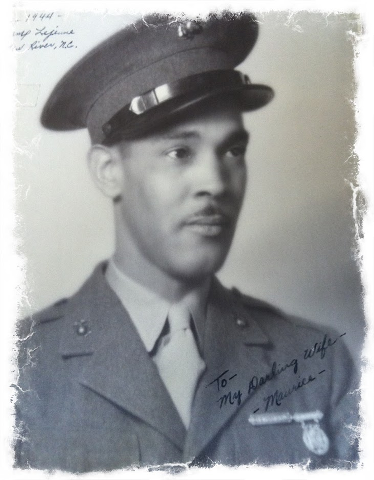 A photo of Marine Corps Pvt. Maurice Burns with a note to his wife written on it.