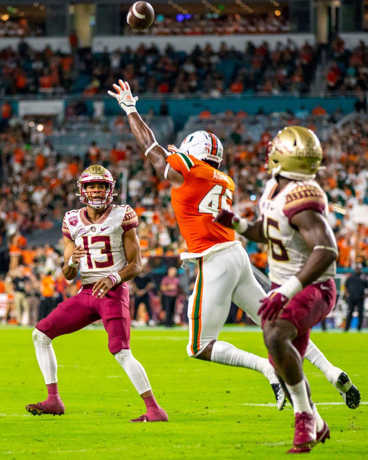 Florida State University quarterback Jordan Travis (13) throws to line backer DJ Lundy (46) for a touchdown during the first quarter of an ACC football game against University of Miami at Hard Rock Stadium in Miami Gardens on Saturday, November 5, 2022.