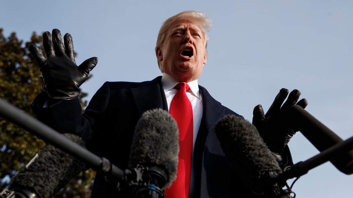 President Donald Trump talks to media on the South Lawn of the White House in Washington, Saturday, Dec. 8, 2018.