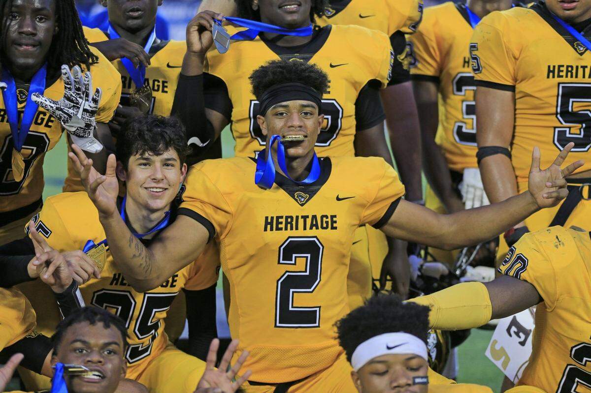 American Heritage Patriots cornerback Patrick Surtain II (2) celebrates after as American Heritage defeats Baker County Wildcats 44-15 in Class 5A State High School Football Championship at Camping World Stadium in Orlando on Friday, December 8, 2017.