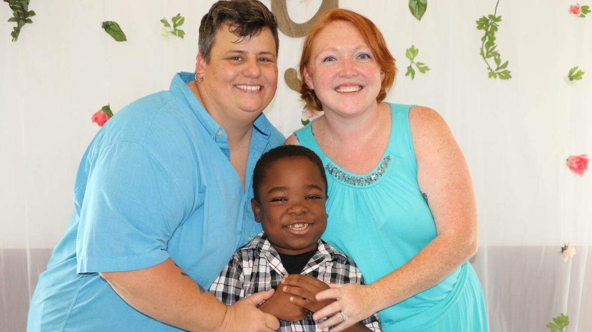 Deena Ruth Cruce and Amanda Williams Cruce with their nine-year-old foster son.